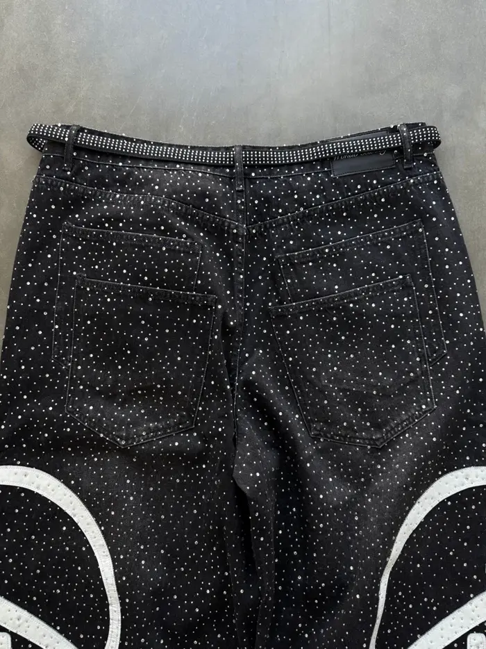 Black sweatpants with yellow script and varsity print